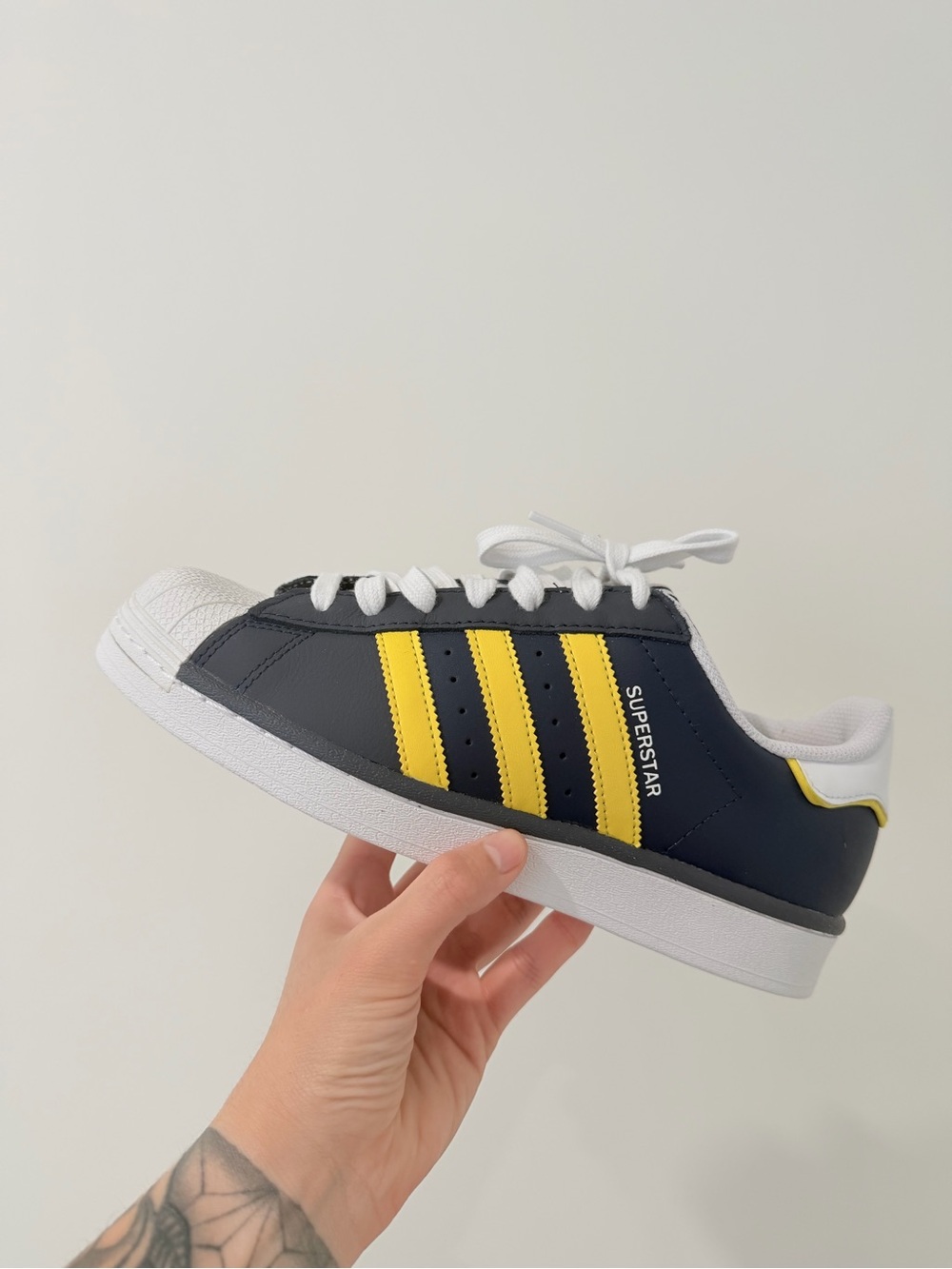 adidas men’s Superstar Sneakers - Navy with Yellow Stripes